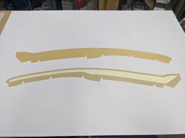テンションを逃がす独自形状とハーフカットで作業性を向上。アーチ形状の特注マスキング | マスキング・表面保護 課題解決ナビ テンションを逃がす独自形状とハーフカットで作業性を向上。アーチ形状の特注マスキング | マスキング・表面保護 課題解決ナビ